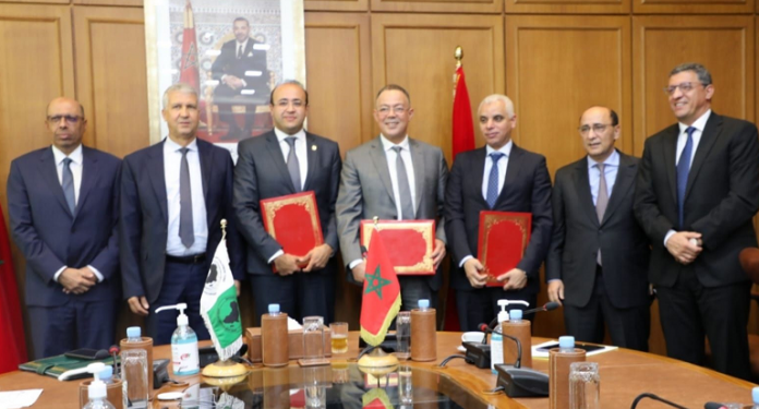 فوزي لقجع يوقع مع البنك الإفريقي للتنمية اتفاقية شراكة لدعم إنتاج الحبوب والحماية الاجتماعية في المملكة